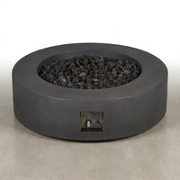Brookhurst 43 In. W X 13 In. H round Outdoor GFRC Liquid Propane Fire Pit in Carbon with Lava Rocks — Studio Shot