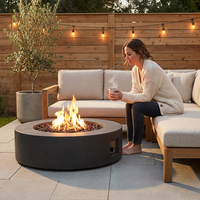 Brookhurst 43 In. W X 13 In. H round Outdoor GFRC Liquid Propane Fire Pit in Carbon with Lava Rocks — Lifestyle